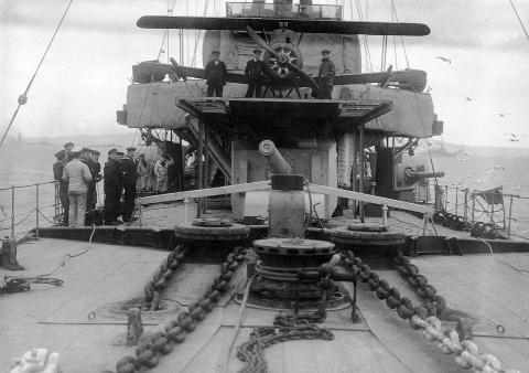 HMS Caroline with aircraft on flying off platform