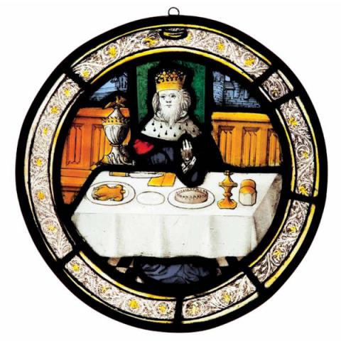Stained glass roundel depicting the King with plenty of food at the table, representing December