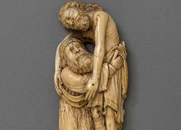 An ivory carving of Joseph of Arimathea lifting Christ's body from the cross