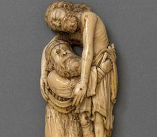 An ivory carving of Joseph of Arimathea lifting Christ's body from the cross