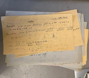 A pile of handwritten papers
